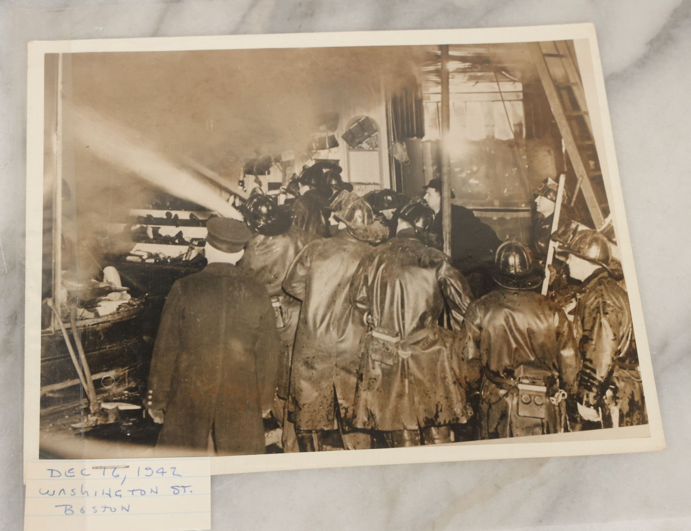 Lot 001 - Extensive Grouping Of 100+ Documentary Press Photos Of Firefighters Battling Fires, Aftermath And Destruction, And Firefighting Apperatus, In And Around The City Of Boston, Late 1930s To 1950s, With Notes Regarding Date And Location, 9" x 7"