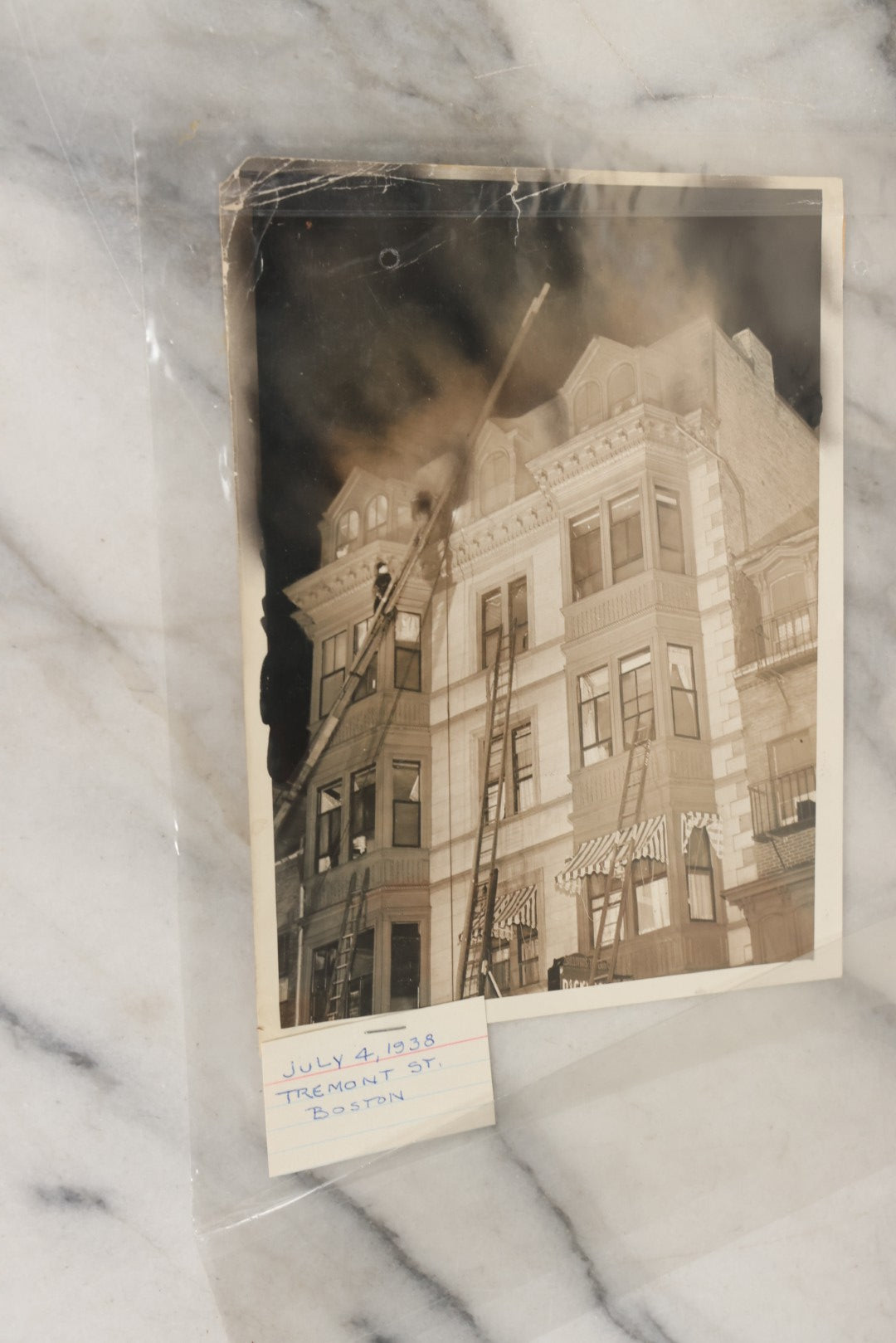 Lot 001 - Extensive Grouping Of 100+ Documentary Press Photos Of Firefighters Battling Fires, Aftermath And Destruction, And Firefighting Apperatus, In And Around The City Of Boston, Late 1930s To 1950s, With Notes Regarding Date And Location, 9" x 7"