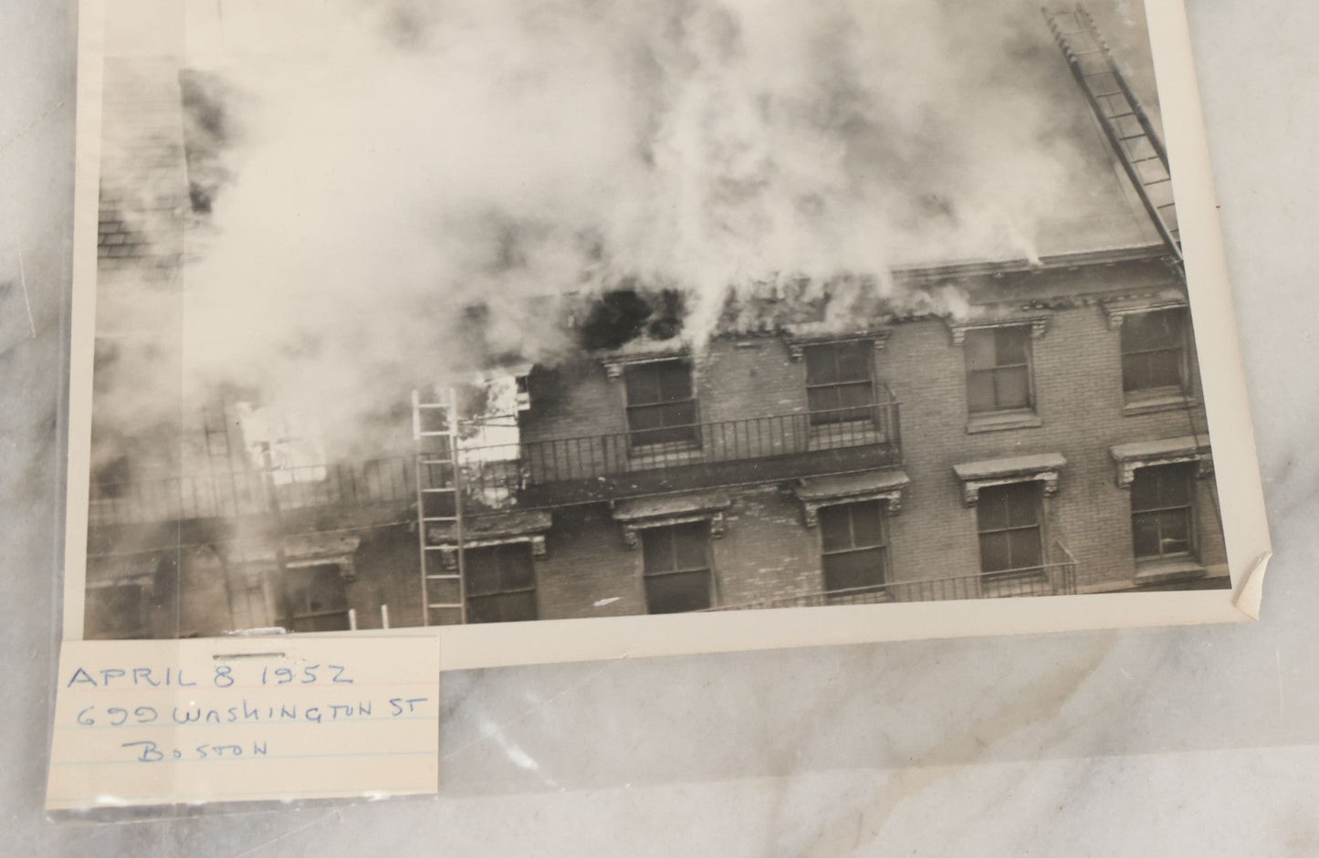 Lot 001 - Extensive Grouping Of 100+ Documentary Press Photos Of Firefighters Battling Fires, Aftermath And Destruction, And Firefighting Apperatus, In And Around The City Of Boston, Late 1930s To 1950s, With Notes Regarding Date And Location, 9" x 7"