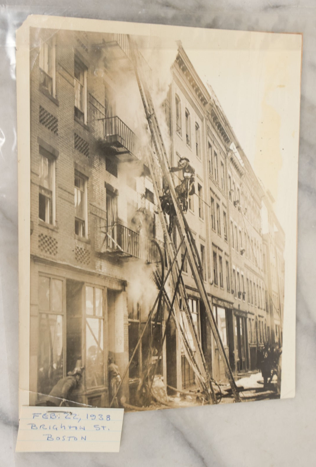 Lot 001 - Extensive Grouping Of 100+ Documentary Press Photos Of Firefighters Battling Fires, Aftermath And Destruction, And Firefighting Apperatus, In And Around The City Of Boston, Late 1930s To 1950s, With Notes Regarding Date And Location, 9" x 7"