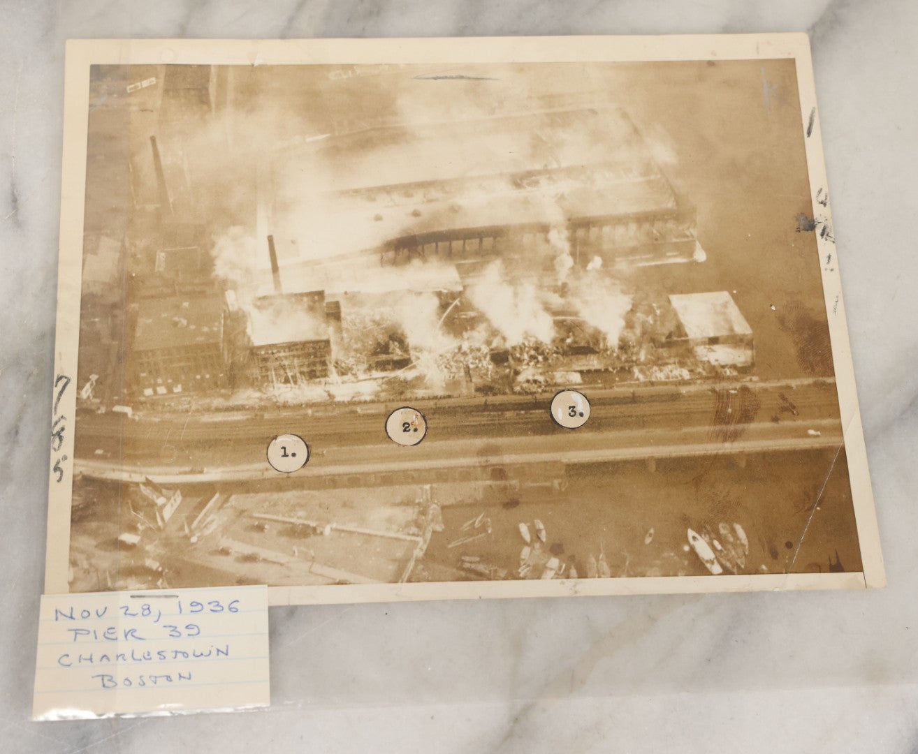 Lot 001 - Extensive Grouping Of 100+ Documentary Press Photos Of Firefighters Battling Fires, Aftermath And Destruction, And Firefighting Apperatus, In And Around The City Of Boston, Late 1930s To 1950s, With Notes Regarding Date And Location, 9" x 7"