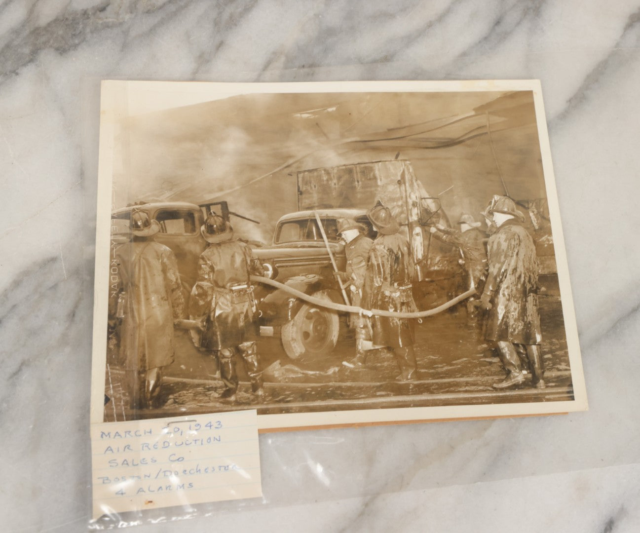 Lot 001 - Extensive Grouping Of 100+ Documentary Press Photos Of Firefighters Battling Fires, Aftermath And Destruction, And Firefighting Apperatus, In And Around The City Of Boston, Late 1930s To 1950s, With Notes Regarding Date And Location, 9" x 7"