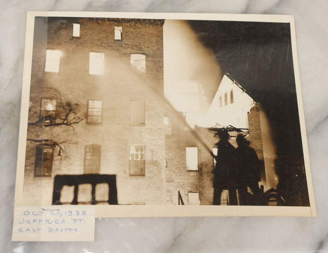 Lot 001 - Extensive Grouping Of 100+ Documentary Press Photos Of Firefighters Battling Fires, Aftermath And Destruction, And Firefighting Apperatus, In And Around The City Of Boston, Late 1930s To 1950s, With Notes Regarding Date And Location, 9" x 7"