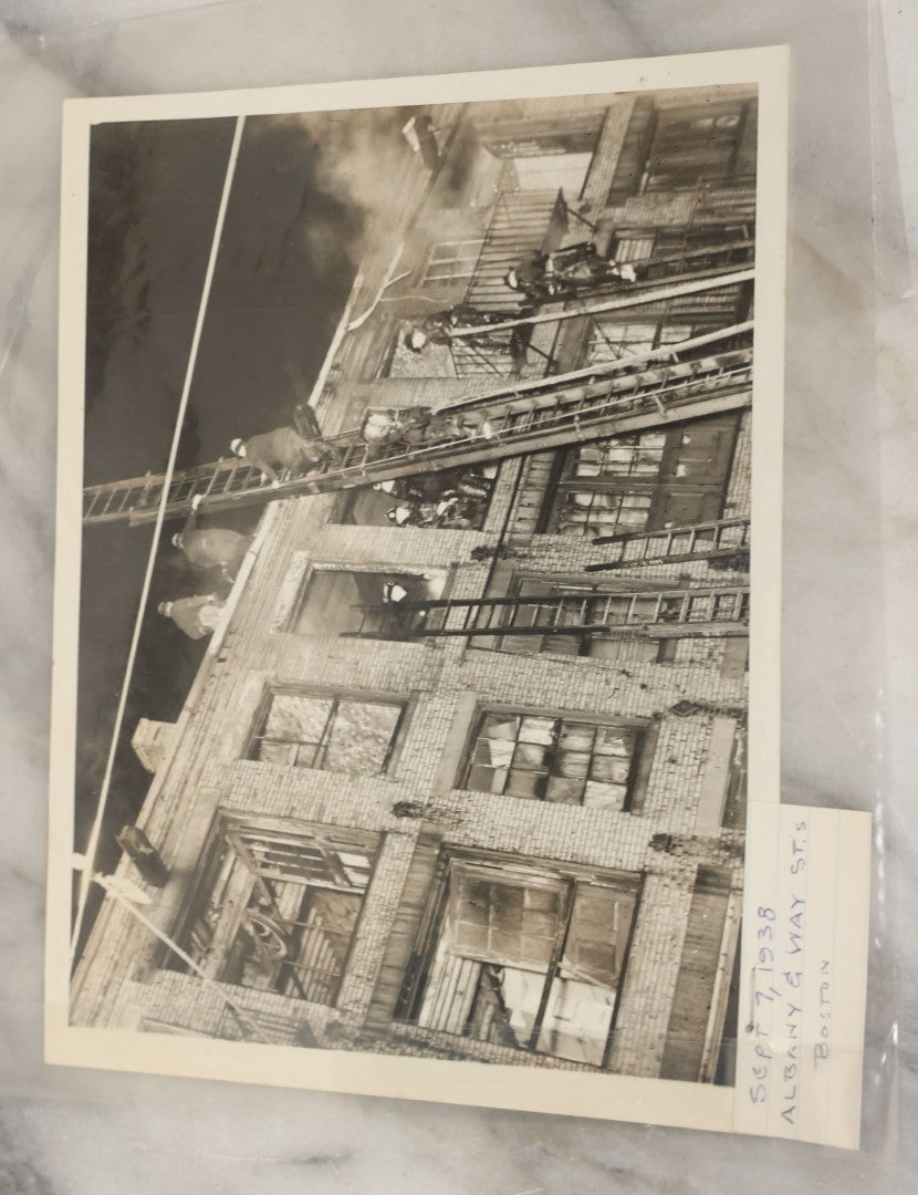 Lot 001 - Extensive Grouping Of 100+ Documentary Press Photos Of Firefighters Battling Fires, Aftermath And Destruction, And Firefighting Apperatus, In And Around The City Of Boston, Late 1930s To 1950s, With Notes Regarding Date And Location, 9" x 7"
