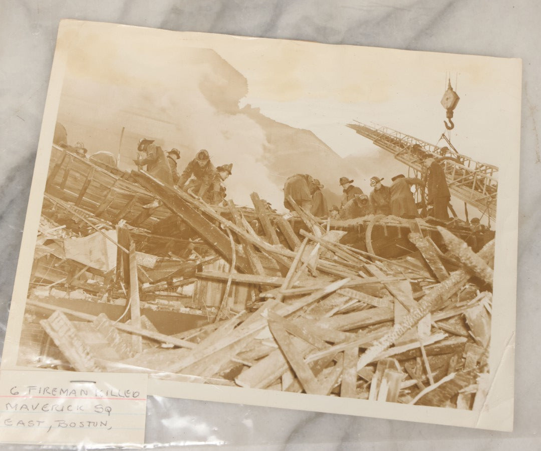 Lot 001 - Extensive Grouping Of 100+ Documentary Press Photos Of Firefighters Battling Fires, Aftermath And Destruction, And Firefighting Apperatus, In And Around The City Of Boston, Late 1930s To 1950s, With Notes Regarding Date And Location, 9" x 7"