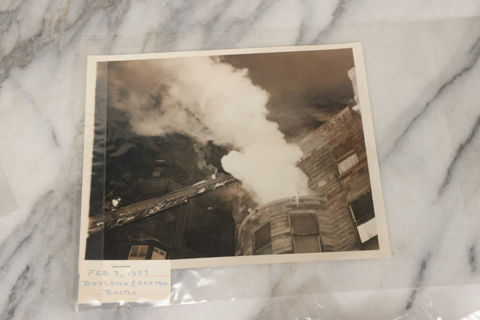 Lot 001 - Extensive Grouping Of 100+ Documentary Press Photos Of Firefighters Battling Fires, Aftermath And Destruction, And Firefighting Apperatus, In And Around The City Of Boston, Late 1930s To 1950s, With Notes Regarding Date And Location, 9" x 7"