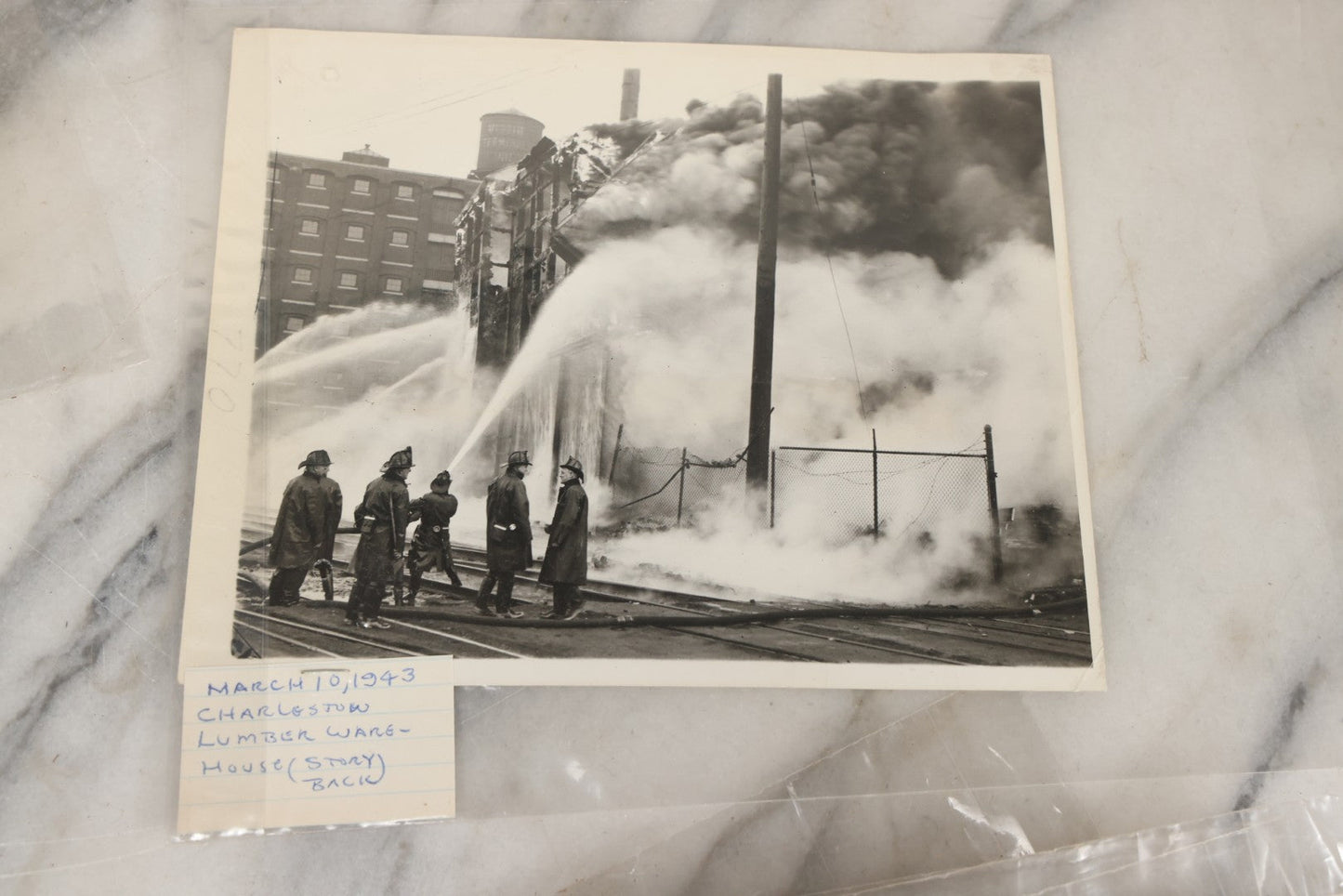 Lot 001 - Extensive Grouping Of 100+ Documentary Press Photos Of Firefighters Battling Fires, Aftermath And Destruction, And Firefighting Apperatus, In And Around The City Of Boston, Late 1930s To 1950s, With Notes Regarding Date And Location, 9" x 7"