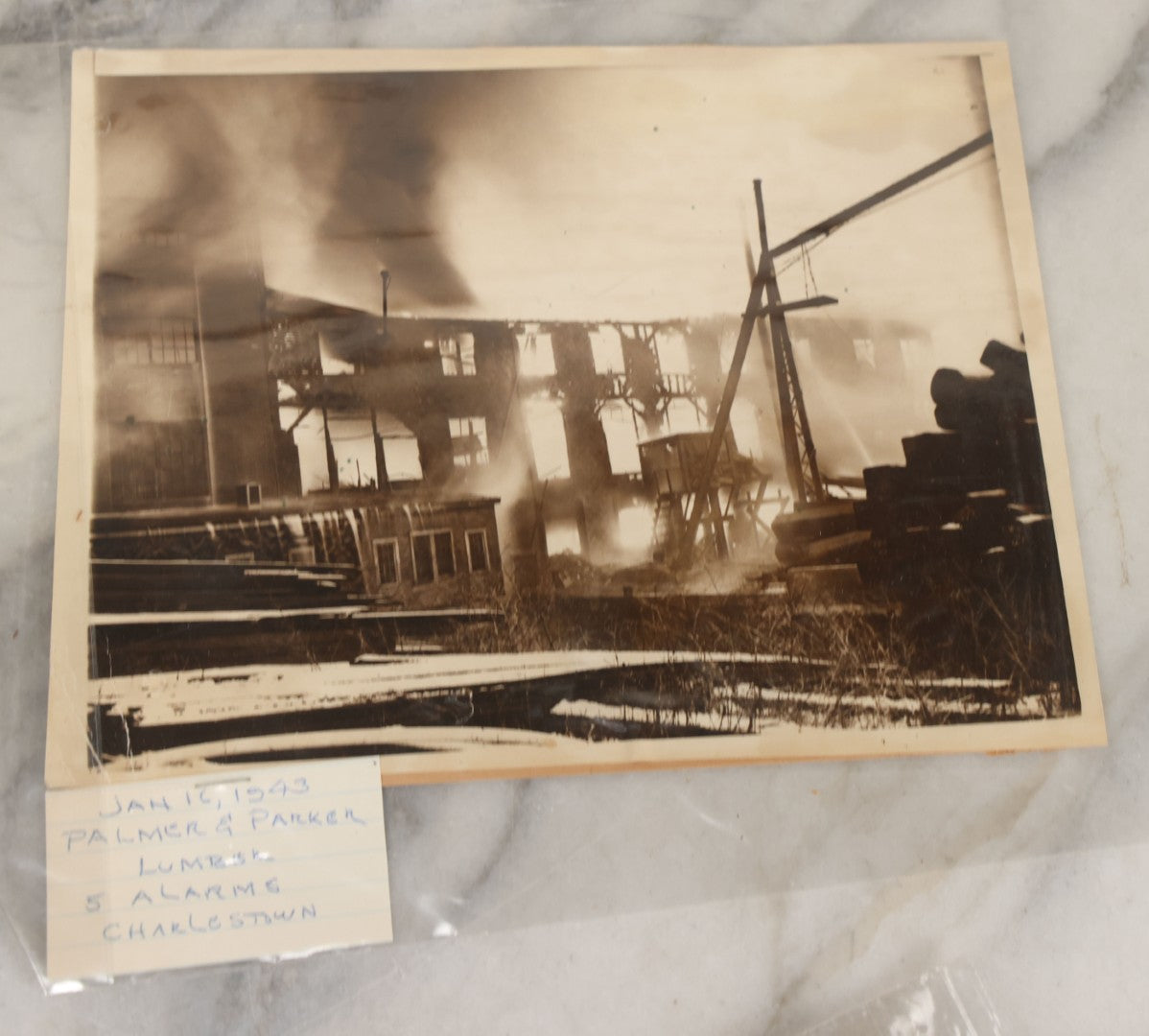 Lot 001 - Extensive Grouping Of 100+ Documentary Press Photos Of Firefighters Battling Fires, Aftermath And Destruction, And Firefighting Apperatus, In And Around The City Of Boston, Late 1930s To 1950s, With Notes Regarding Date And Location, 9" x 7"