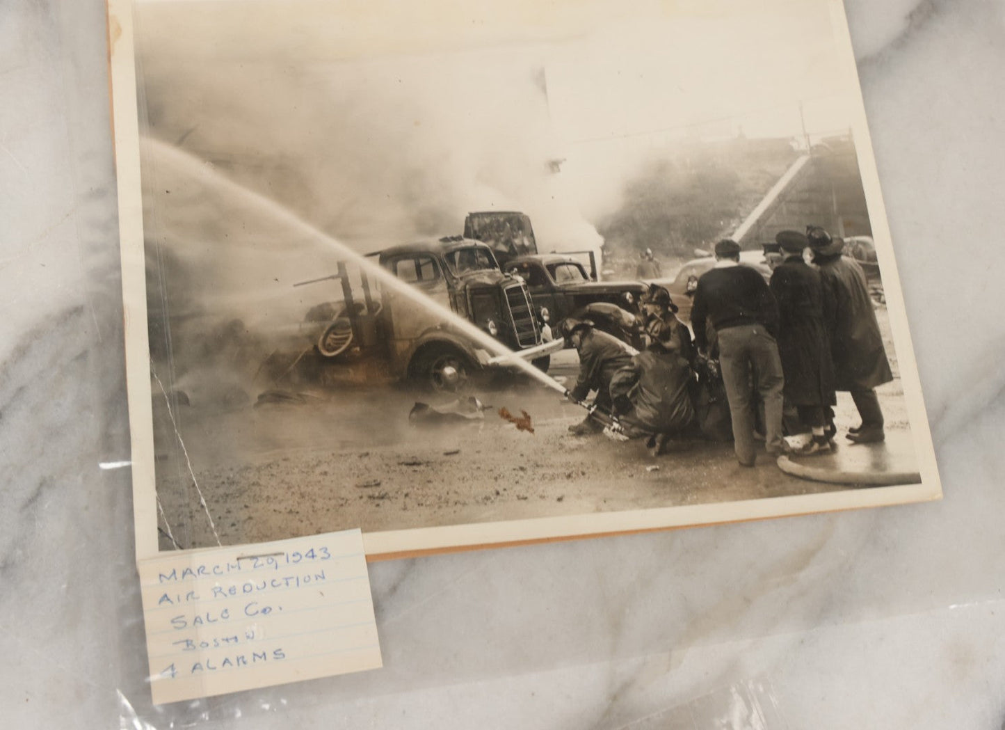Lot 001 - Extensive Grouping Of 100+ Documentary Press Photos Of Firefighters Battling Fires, Aftermath And Destruction, And Firefighting Apperatus, In And Around The City Of Boston, Late 1930s To 1950s, With Notes Regarding Date And Location, 9" x 7"