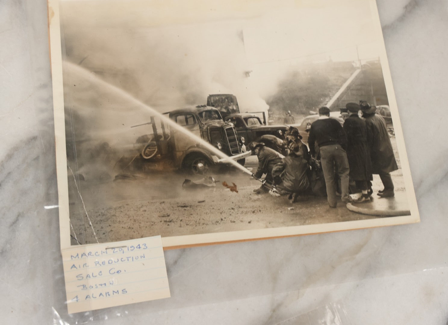 Lot 001 - Extensive Grouping Of 100+ Documentary Press Photos Of Firefighters Battling Fires, Aftermath And Destruction, And Firefighting Apperatus, In And Around The City Of Boston, Late 1930s To 1950s, With Notes Regarding Date And Location, 9" x 7"