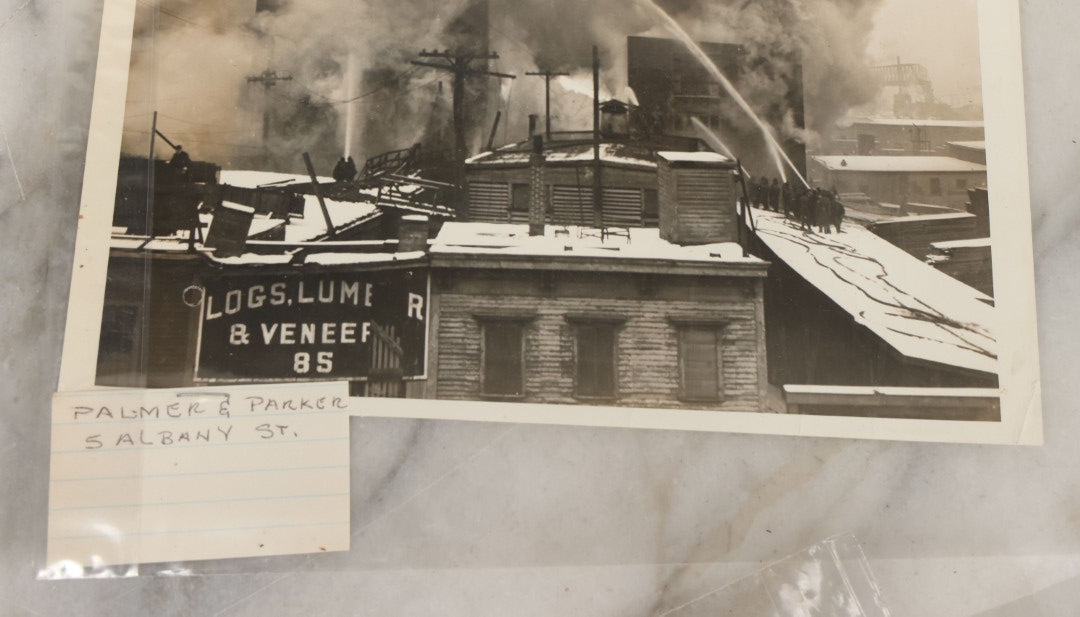 Lot 001 - Extensive Grouping Of 100+ Documentary Press Photos Of Firefighters Battling Fires, Aftermath And Destruction, And Firefighting Apperatus, In And Around The City Of Boston, Late 1930s To 1950s, With Notes Regarding Date And Location, 9" x 7"