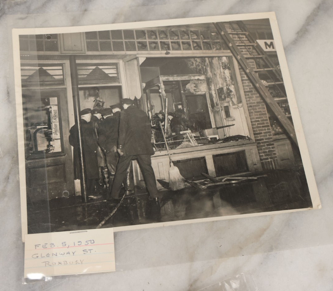 Lot 001 - Extensive Grouping Of 100+ Documentary Press Photos Of Firefighters Battling Fires, Aftermath And Destruction, And Firefighting Apperatus, In And Around The City Of Boston, Late 1930s To 1950s, With Notes Regarding Date And Location, 9" x 7"