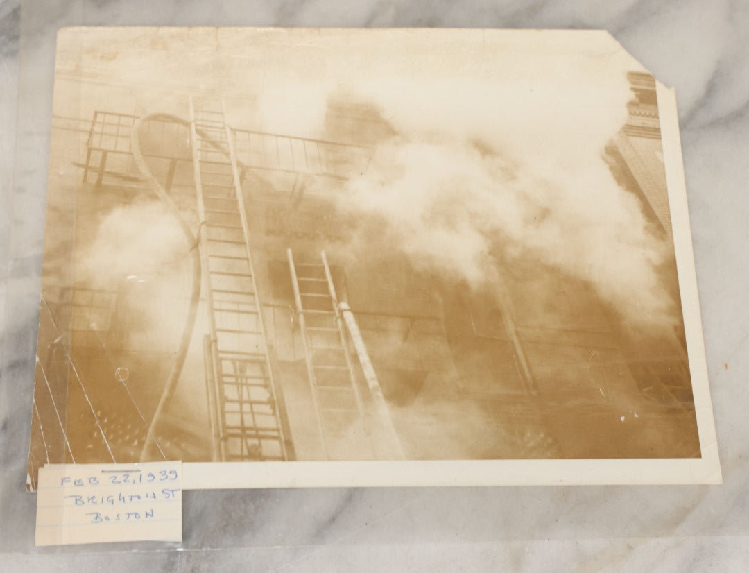 Lot 001 - Extensive Grouping Of 100+ Documentary Press Photos Of Firefighters Battling Fires, Aftermath And Destruction, And Firefighting Apperatus, In And Around The City Of Boston, Late 1930s To 1950s, With Notes Regarding Date And Location, 9" x 7"