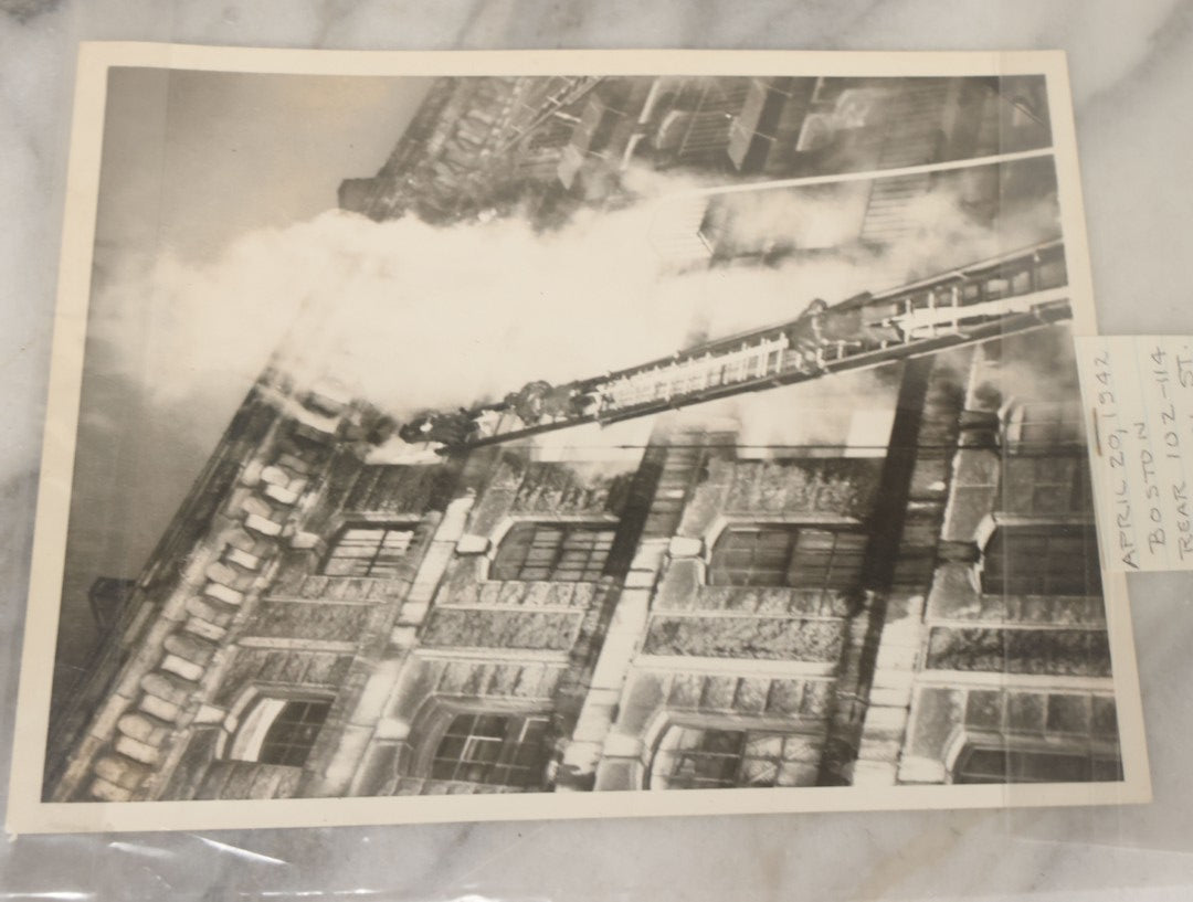 Lot 001 - Extensive Grouping Of 100+ Documentary Press Photos Of Firefighters Battling Fires, Aftermath And Destruction, And Firefighting Apperatus, In And Around The City Of Boston, Late 1930s To 1950s, With Notes Regarding Date And Location, 9" x 7"