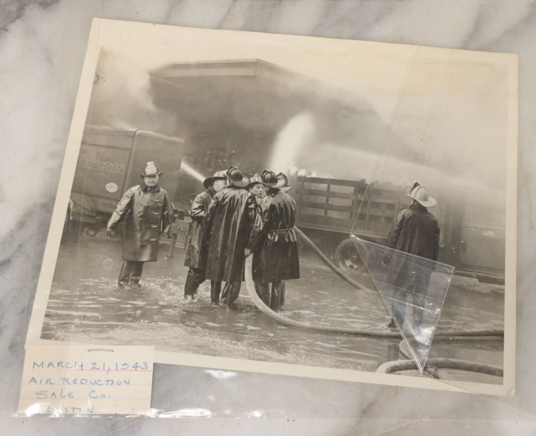Lot 001 - Extensive Grouping Of 100+ Documentary Press Photos Of Firefighters Battling Fires, Aftermath And Destruction, And Firefighting Apperatus, In And Around The City Of Boston, Late 1930s To 1950s, With Notes Regarding Date And Location, 9" x 7"