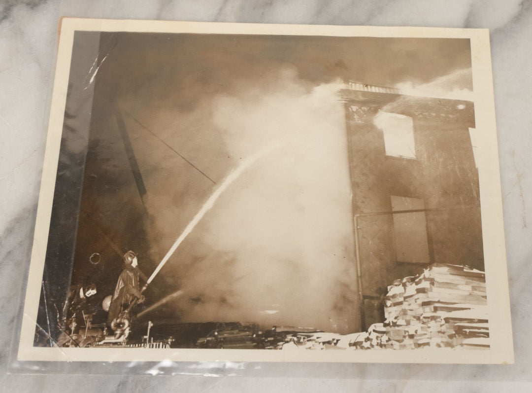 Lot 001 - Extensive Grouping Of 100+ Documentary Press Photos Of Firefighters Battling Fires, Aftermath And Destruction, And Firefighting Apperatus, In And Around The City Of Boston, Late 1930s To 1950s, With Notes Regarding Date And Location, 9" x 7"