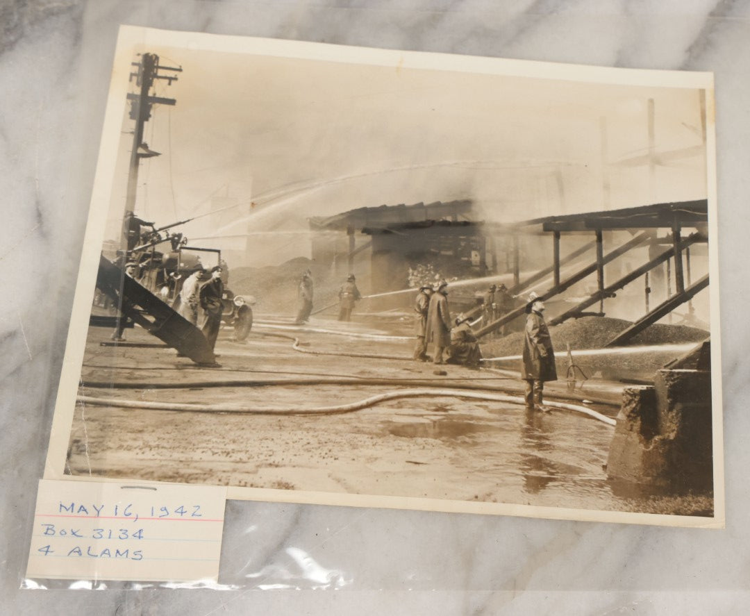 Lot 001 - Extensive Grouping Of 100+ Documentary Press Photos Of Firefighters Battling Fires, Aftermath And Destruction, And Firefighting Apperatus, In And Around The City Of Boston, Late 1930s To 1950s, With Notes Regarding Date And Location, 9" x 7"