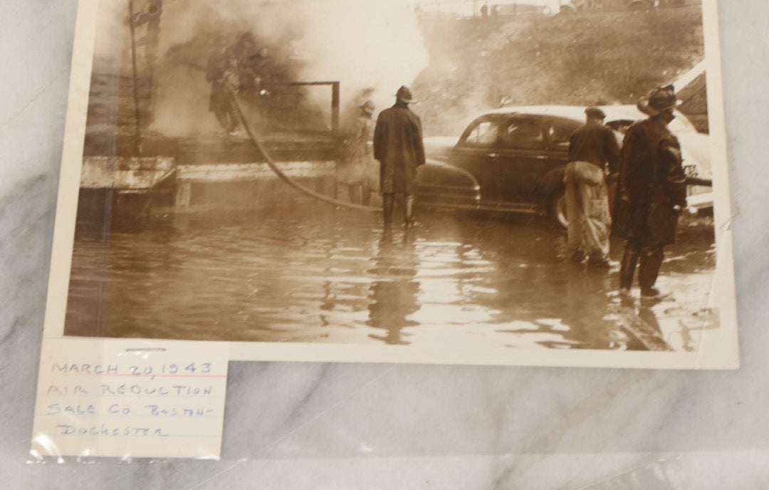 Lot 001 - Extensive Grouping Of 100+ Documentary Press Photos Of Firefighters Battling Fires, Aftermath And Destruction, And Firefighting Apperatus, In And Around The City Of Boston, Late 1930s To 1950s, With Notes Regarding Date And Location, 9" x 7"