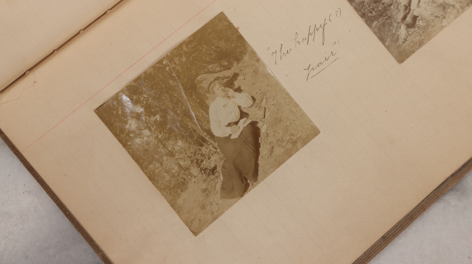 Lot 064 - Antique Snapshot Photo Album Scrapbook Contained In A Record Ledger With 40+ Photos And Scraps, With Handwritten Enscriptions, Including Interior Photos, Outdoor Photos, And More, Circa 1900, Hand Drawn Flower Scraps