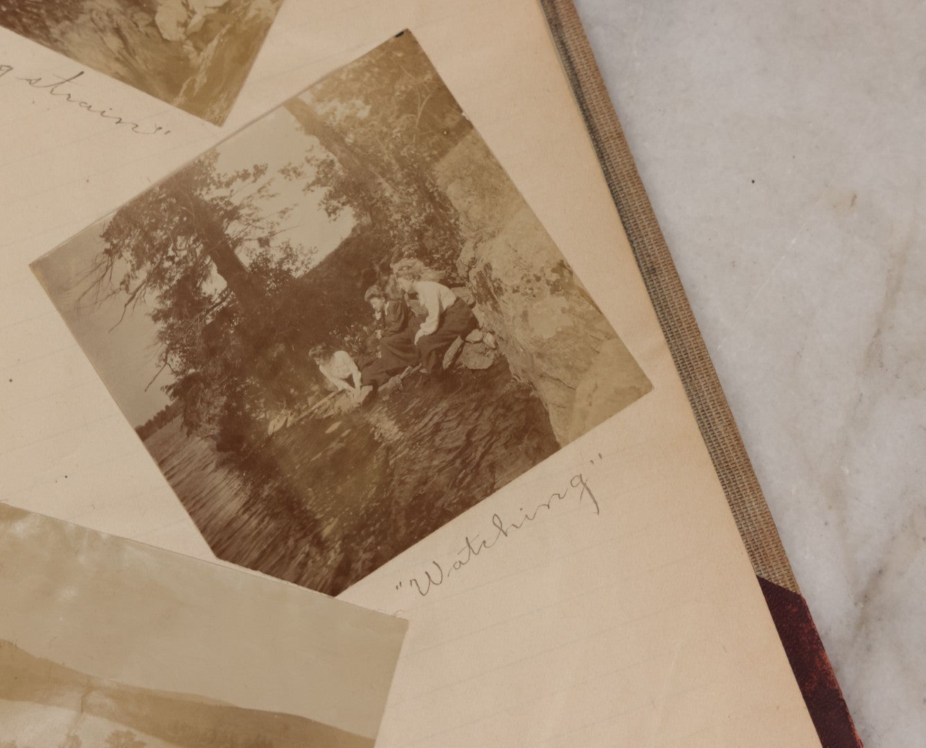 Lot 064 - Antique Snapshot Photo Album Scrapbook Contained In A Record Ledger With 40+ Photos And Scraps, With Handwritten Enscriptions, Including Interior Photos, Outdoor Photos, And More, Circa 1900, Hand Drawn Flower Scraps