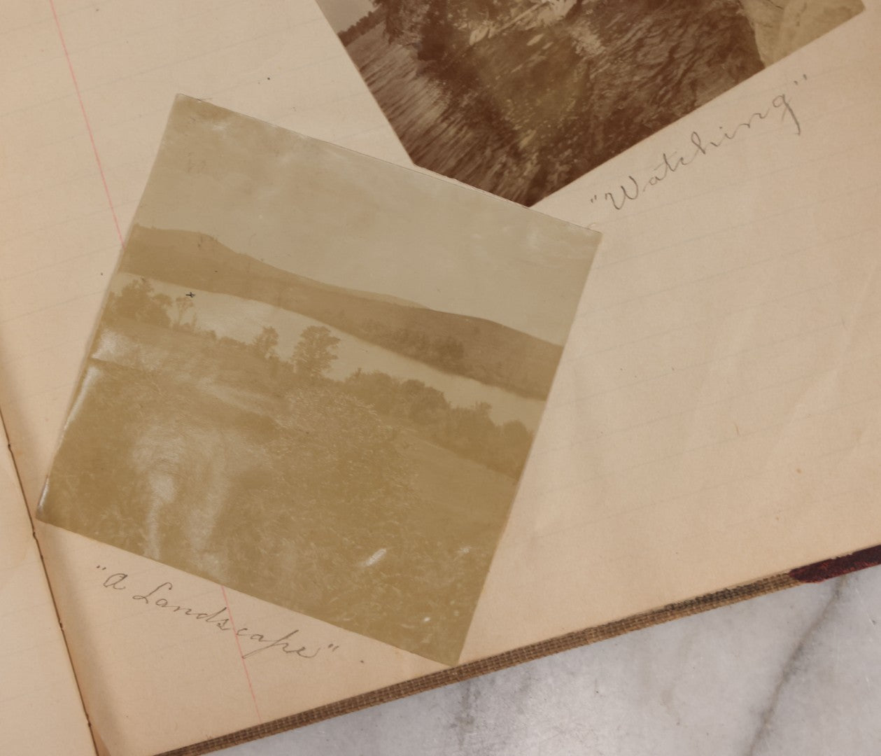 Lot 064 - Antique Snapshot Photo Album Scrapbook Contained In A Record Ledger With 40+ Photos And Scraps, With Handwritten Enscriptions, Including Interior Photos, Outdoor Photos, And More, Circa 1900, Hand Drawn Flower Scraps