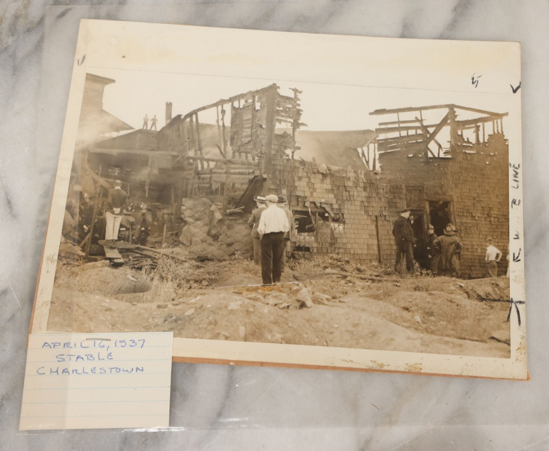 Lot 001 - Extensive Grouping Of 100+ Documentary Press Photos Of Firefighters Battling Fires, Aftermath And Destruction, And Firefighting Apperatus, In And Around The City Of Boston, Late 1930s To 1950s, With Notes Regarding Date And Location, 9" x 7"