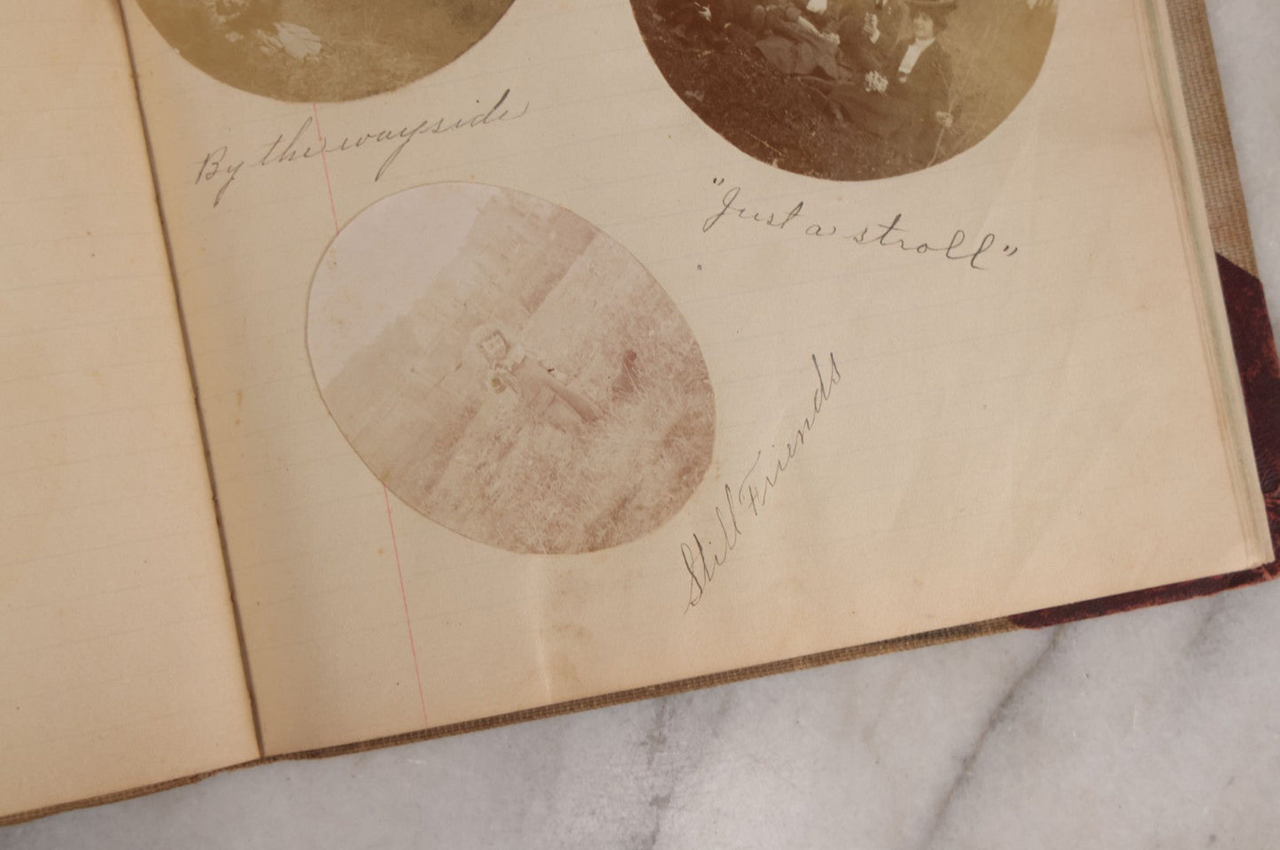 Lot 064 - Antique Snapshot Photo Album Scrapbook Contained In A Record Ledger With 40+ Photos And Scraps, With Handwritten Enscriptions, Including Interior Photos, Outdoor Photos, And More, Circa 1900, Hand Drawn Flower Scraps