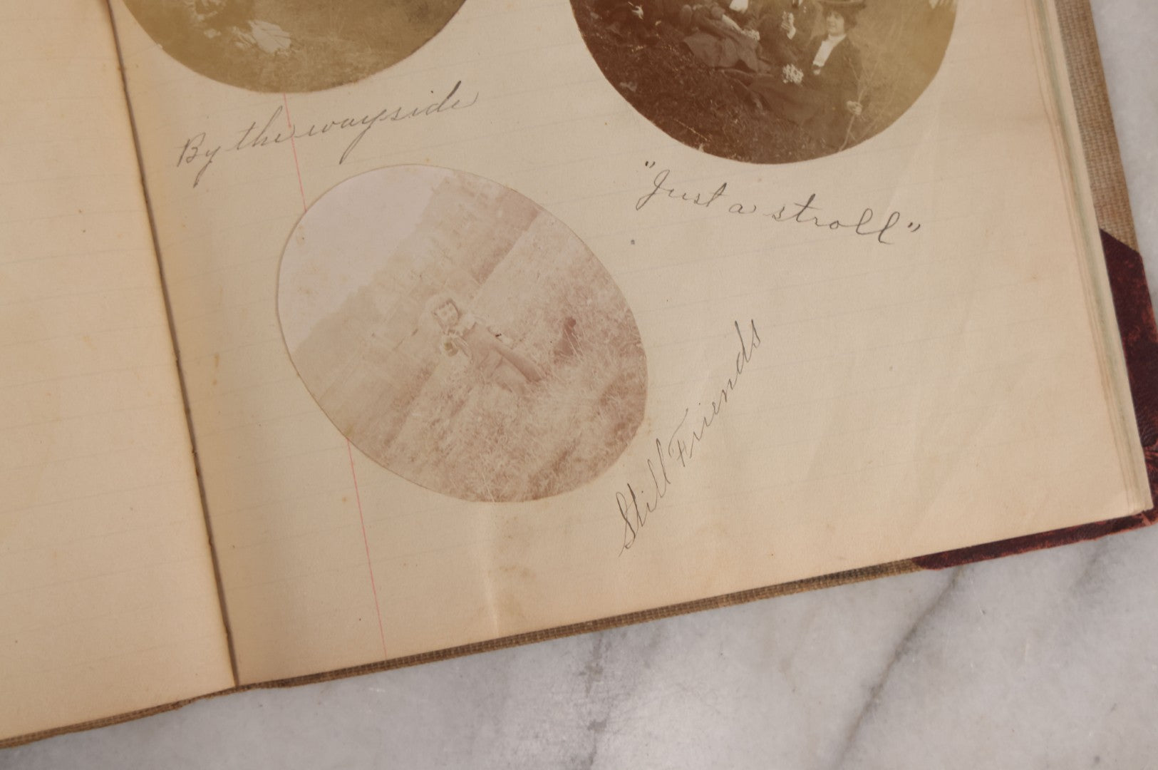 Lot 064 - Antique Snapshot Photo Album Scrapbook Contained In A Record Ledger With 40+ Photos And Scraps, With Handwritten Enscriptions, Including Interior Photos, Outdoor Photos, And More, Circa 1900, Hand Drawn Flower Scraps