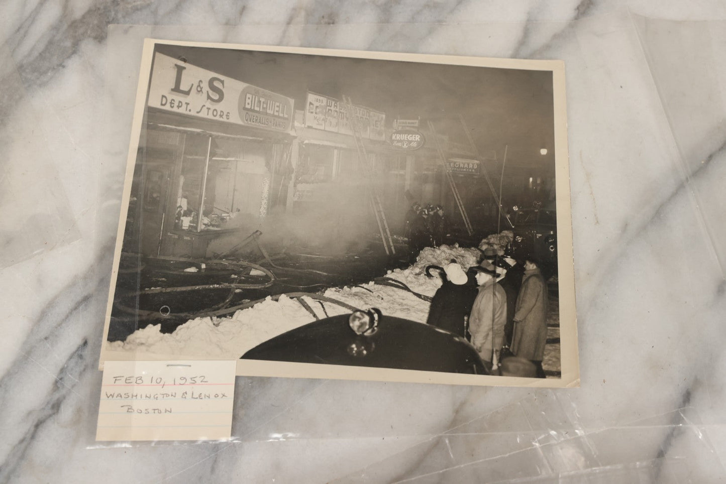 Lot 001 - Extensive Grouping Of 100+ Documentary Press Photos Of Firefighters Battling Fires, Aftermath And Destruction, And Firefighting Apperatus, In And Around The City Of Boston, Late 1930s To 1950s, With Notes Regarding Date And Location, 9" x 7"