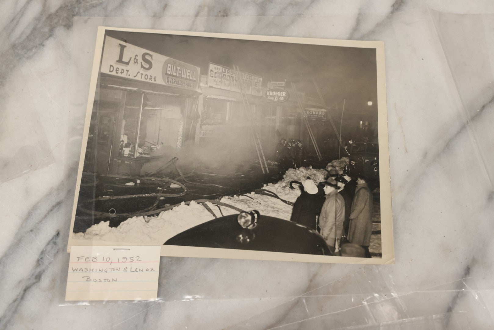 Lot 001 - Extensive Grouping Of 100+ Documentary Press Photos Of Firefighters Battling Fires, Aftermath And Destruction, And Firefighting Apperatus, In And Around The City Of Boston, Late 1930s To 1950s, With Notes Regarding Date And Location, 9" x 7"