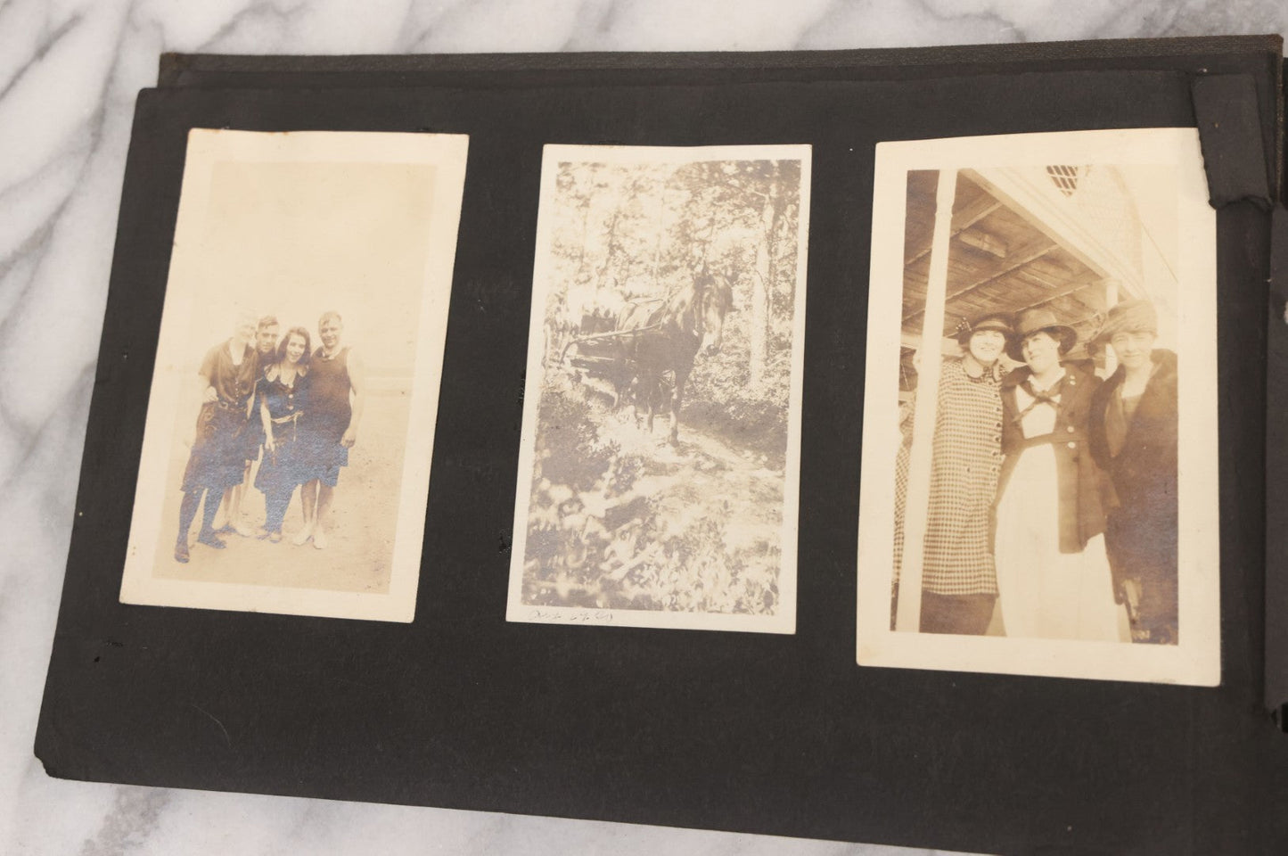 Lot 065 - Vintage Snapshot Photo Album With 95+ Photographs Of The Men And Women Of The 1920s Including Many Photos Of Lakeside Gatherings, Flappers, Swimsuits, And WWI Era Soldiers