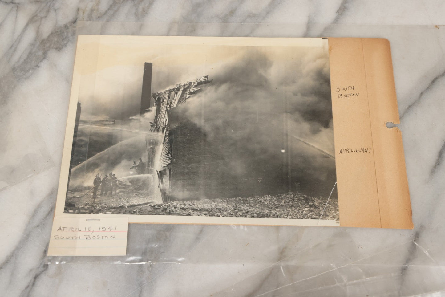 Lot 001 - Extensive Grouping Of 100+ Documentary Press Photos Of Firefighters Battling Fires, Aftermath And Destruction, And Firefighting Apperatus, In And Around The City Of Boston, Late 1930s To 1950s, With Notes Regarding Date And Location, 9" x 7"