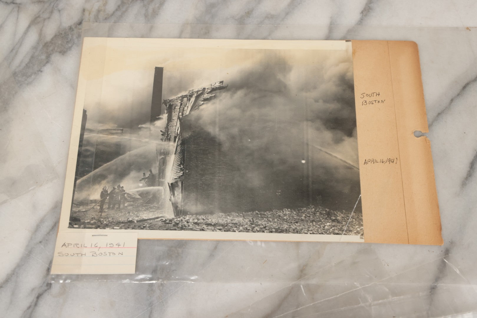 Lot 001 - Extensive Grouping Of 100+ Documentary Press Photos Of Firefighters Battling Fires, Aftermath And Destruction, And Firefighting Apperatus, In And Around The City Of Boston, Late 1930s To 1950s, With Notes Regarding Date And Location, 9" x 7"