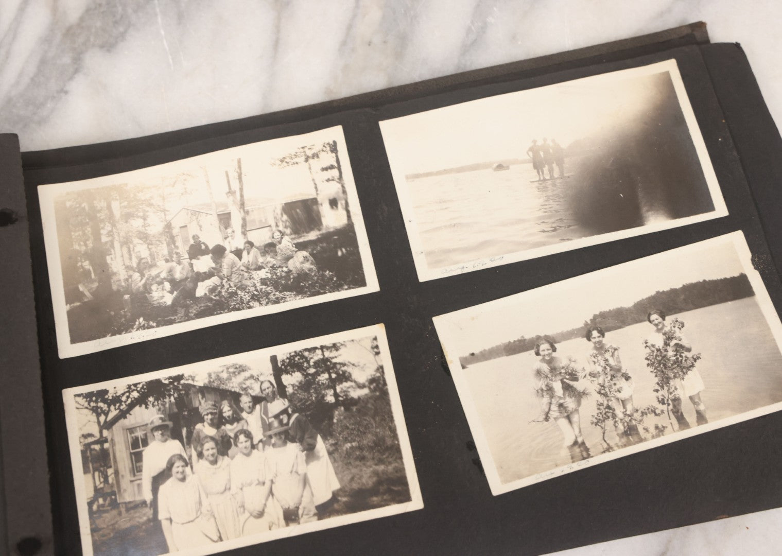 Lot 065 - Vintage Snapshot Photo Album With 95+ Photographs Of The Men And Women Of The 1920s Including Many Photos Of Lakeside Gatherings, Flappers, Swimsuits, And WWI Era Soldiers