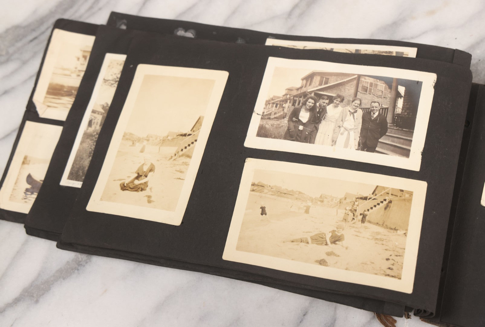 Lot 065 - Vintage Snapshot Photo Album With 95+ Photographs Of The Men And Women Of The 1920s Including Many Photos Of Lakeside Gatherings, Flappers, Swimsuits, And WWI Era Soldiers