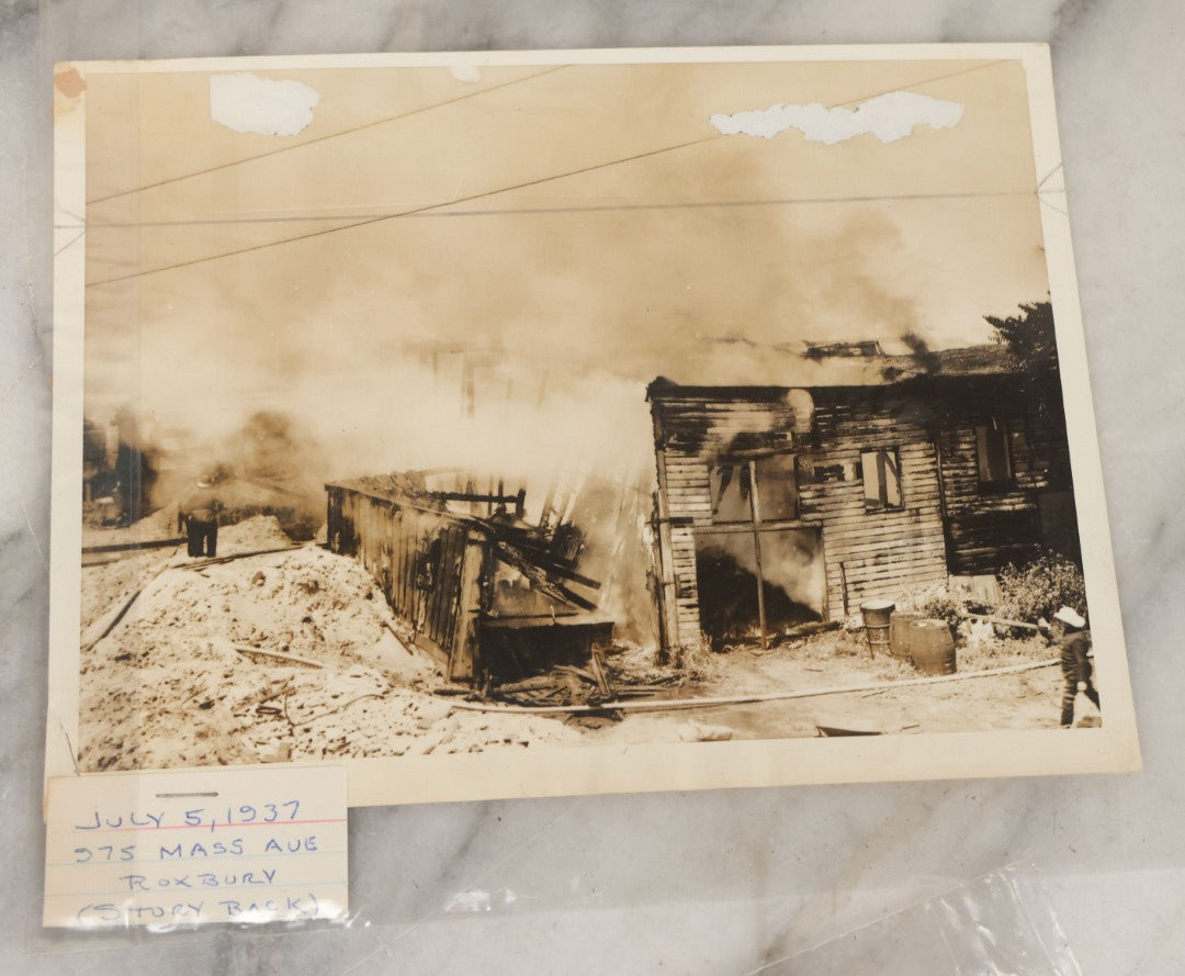 Lot 001 - Extensive Grouping Of 100+ Documentary Press Photos Of Firefighters Battling Fires, Aftermath And Destruction, And Firefighting Apperatus, In And Around The City Of Boston, Late 1930s To 1950s, With Notes Regarding Date And Location, 9" x 7"