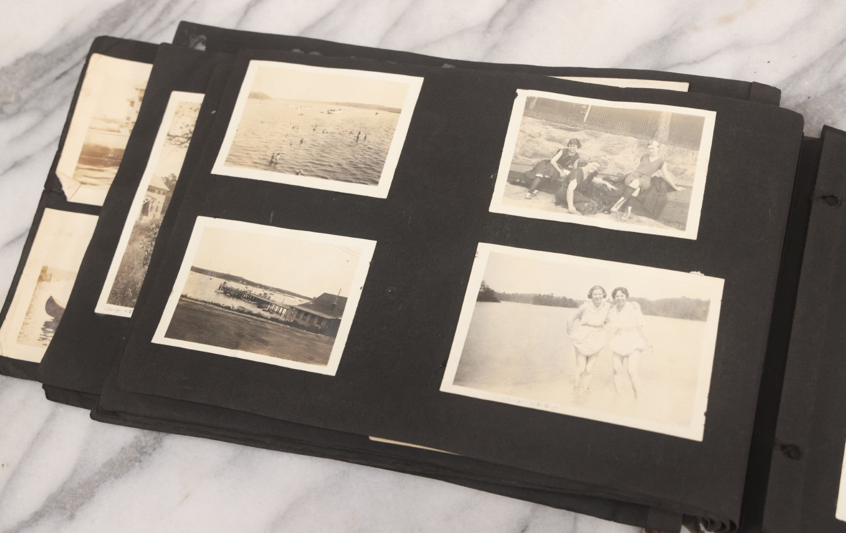 Lot 065 - Vintage Snapshot Photo Album With 95+ Photographs Of The Men And Women Of The 1920s Including Many Photos Of Lakeside Gatherings, Flappers, Swimsuits, And WWI Era Soldiers