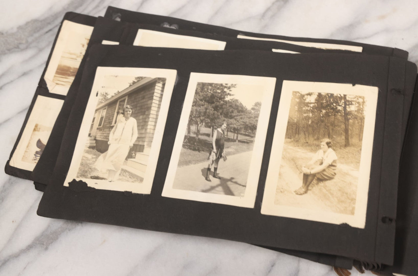 Lot 065 - Vintage Snapshot Photo Album With 95+ Photographs Of The Men And Women Of The 1920s Including Many Photos Of Lakeside Gatherings, Flappers, Swimsuits, And WWI Era Soldiers