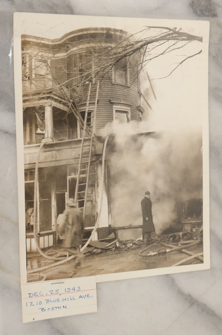 Lot 001 - Extensive Grouping Of 100+ Documentary Press Photos Of Firefighters Battling Fires, Aftermath And Destruction, And Firefighting Apperatus, In And Around The City Of Boston, Late 1930s To 1950s, With Notes Regarding Date And Location, 9" x 7"
