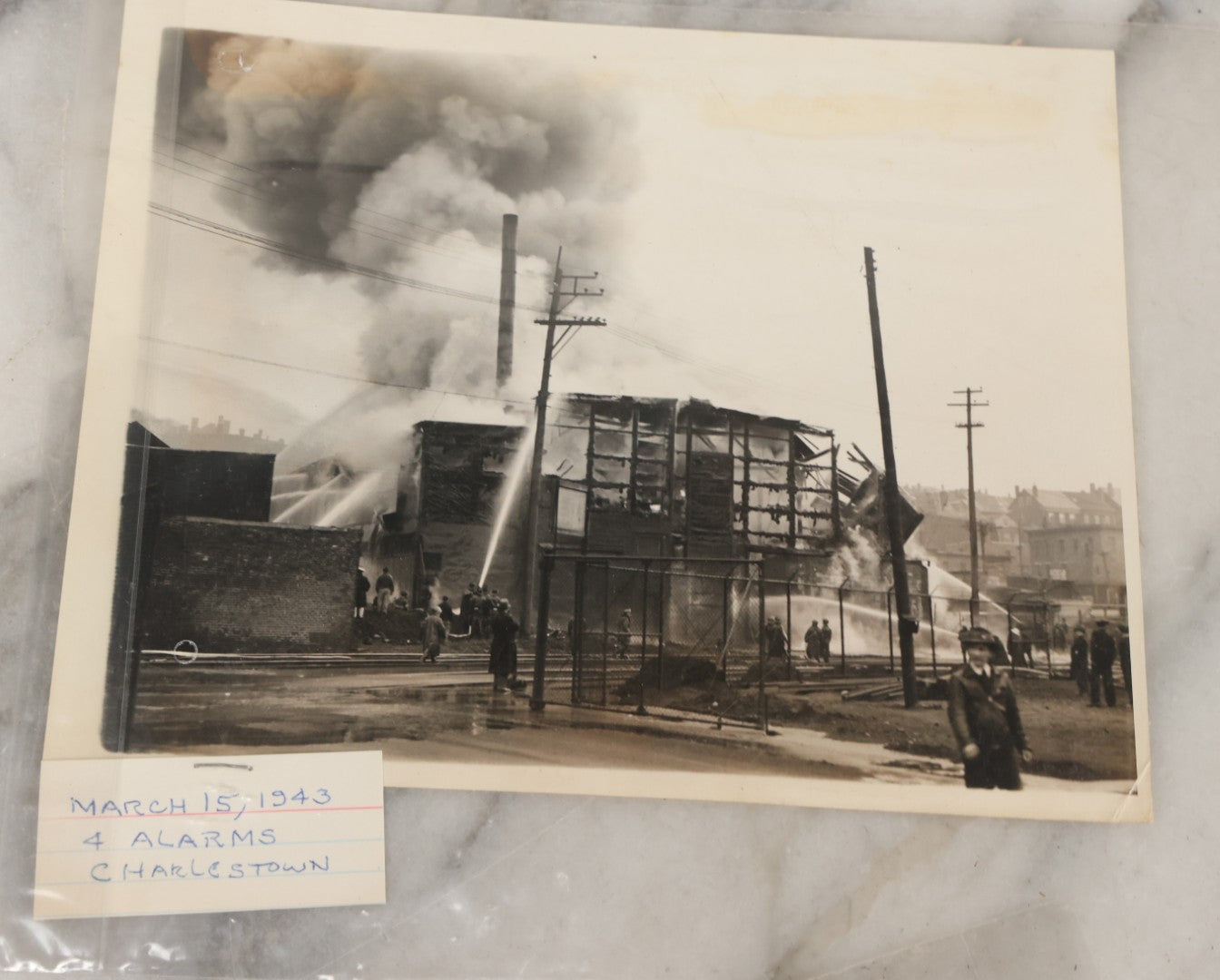Lot 001 - Extensive Grouping Of 100+ Documentary Press Photos Of Firefighters Battling Fires, Aftermath And Destruction, And Firefighting Apperatus, In And Around The City Of Boston, Late 1930s To 1950s, With Notes Regarding Date And Location, 9" x 7"