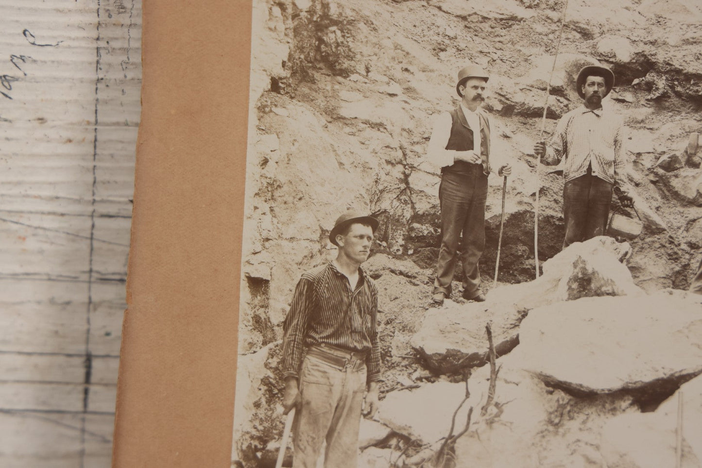 Lot 067 - Antique Boarded Occupational Photograph Of Group Of Seven Miners Posing In Quarry, Holding Sledgehammers And Other Tools
