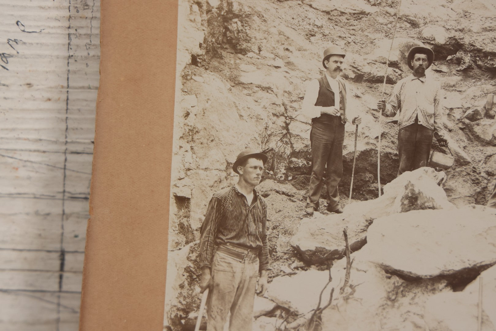 Lot 067 - Antique Boarded Occupational Photograph Of Group Of Seven Miners Posing In Quarry, Holding Sledgehammers And Other Tools