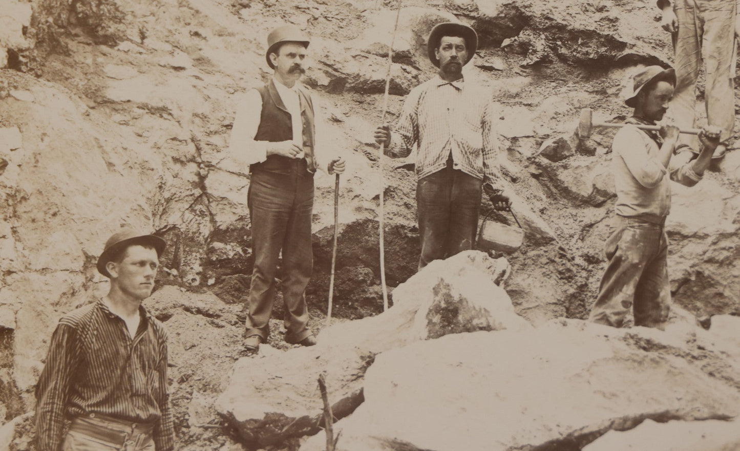 Lot 067 - Antique Boarded Occupational Photograph Of Group Of Seven Miners Posing In Quarry, Holding Sledgehammers And Other Tools