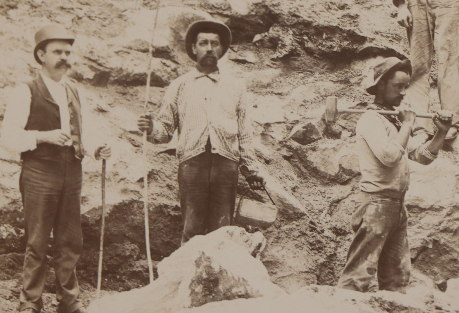 Lot 067 - Antique Boarded Occupational Photograph Of Group Of Seven Miners Posing In Quarry, Holding Sledgehammers And Other Tools