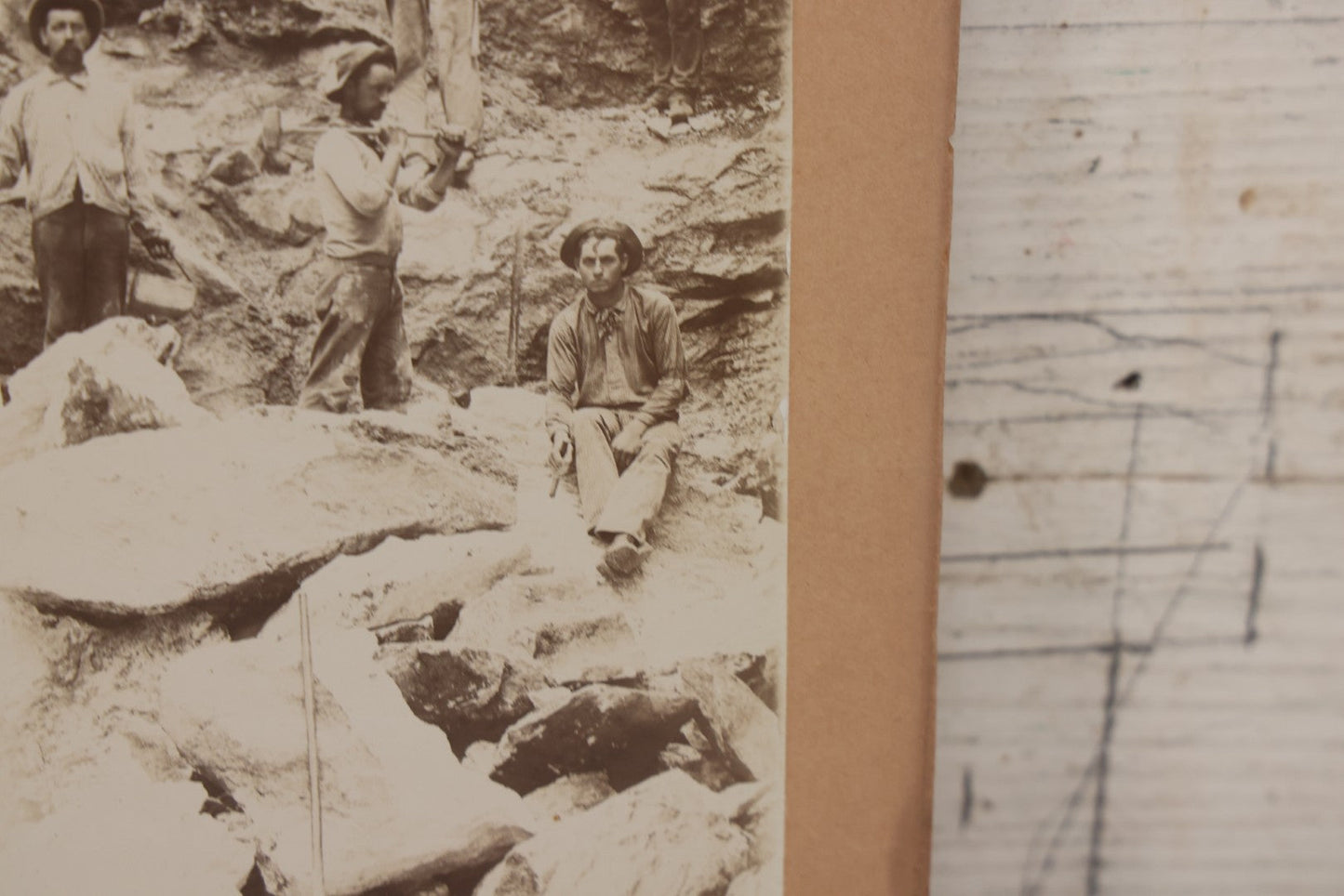 Lot 067 - Antique Boarded Occupational Photograph Of Group Of Seven Miners Posing In Quarry, Holding Sledgehammers And Other Tools