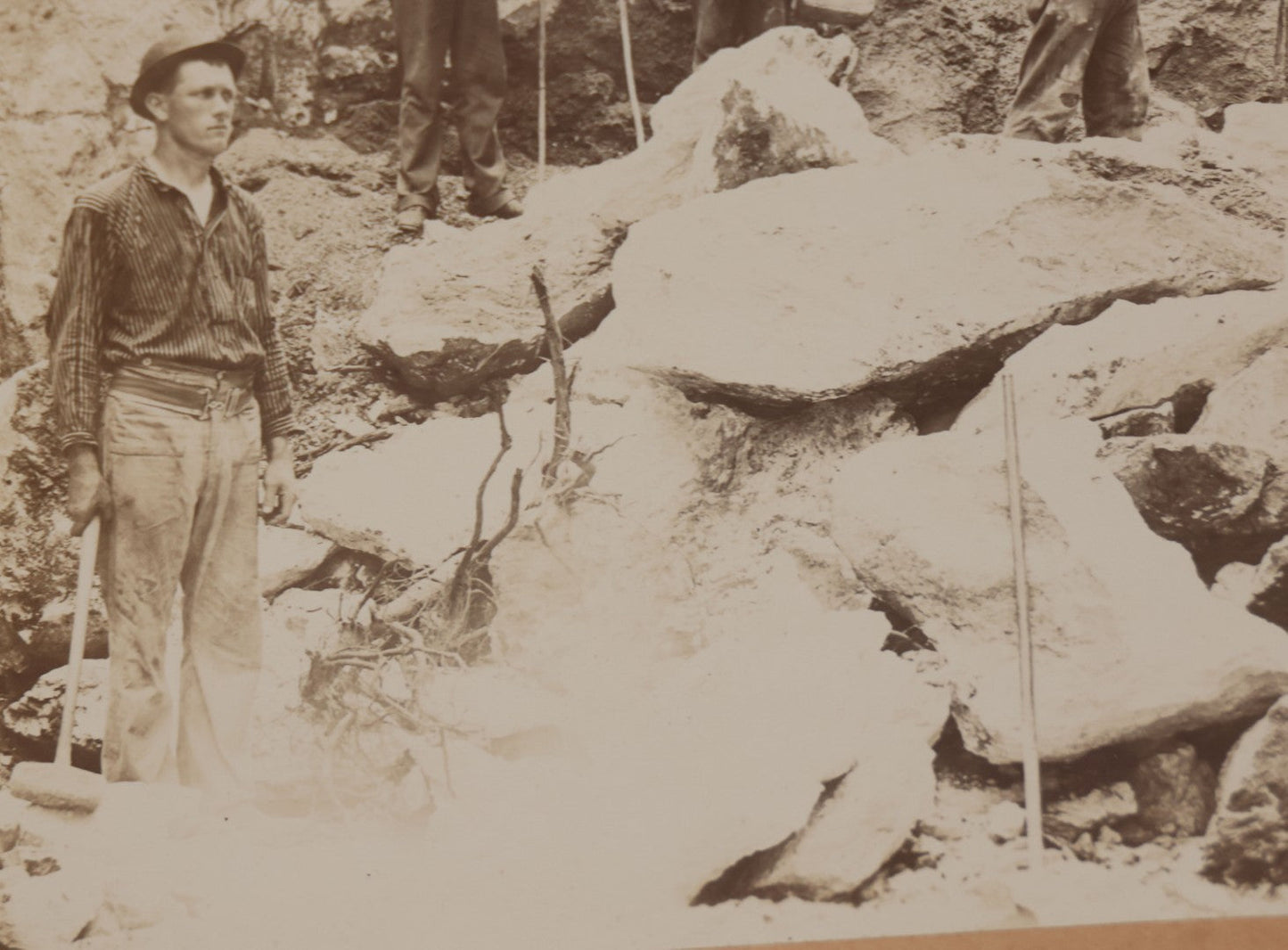 Lot 067 - Antique Boarded Occupational Photograph Of Group Of Seven Miners Posing In Quarry, Holding Sledgehammers And Other Tools