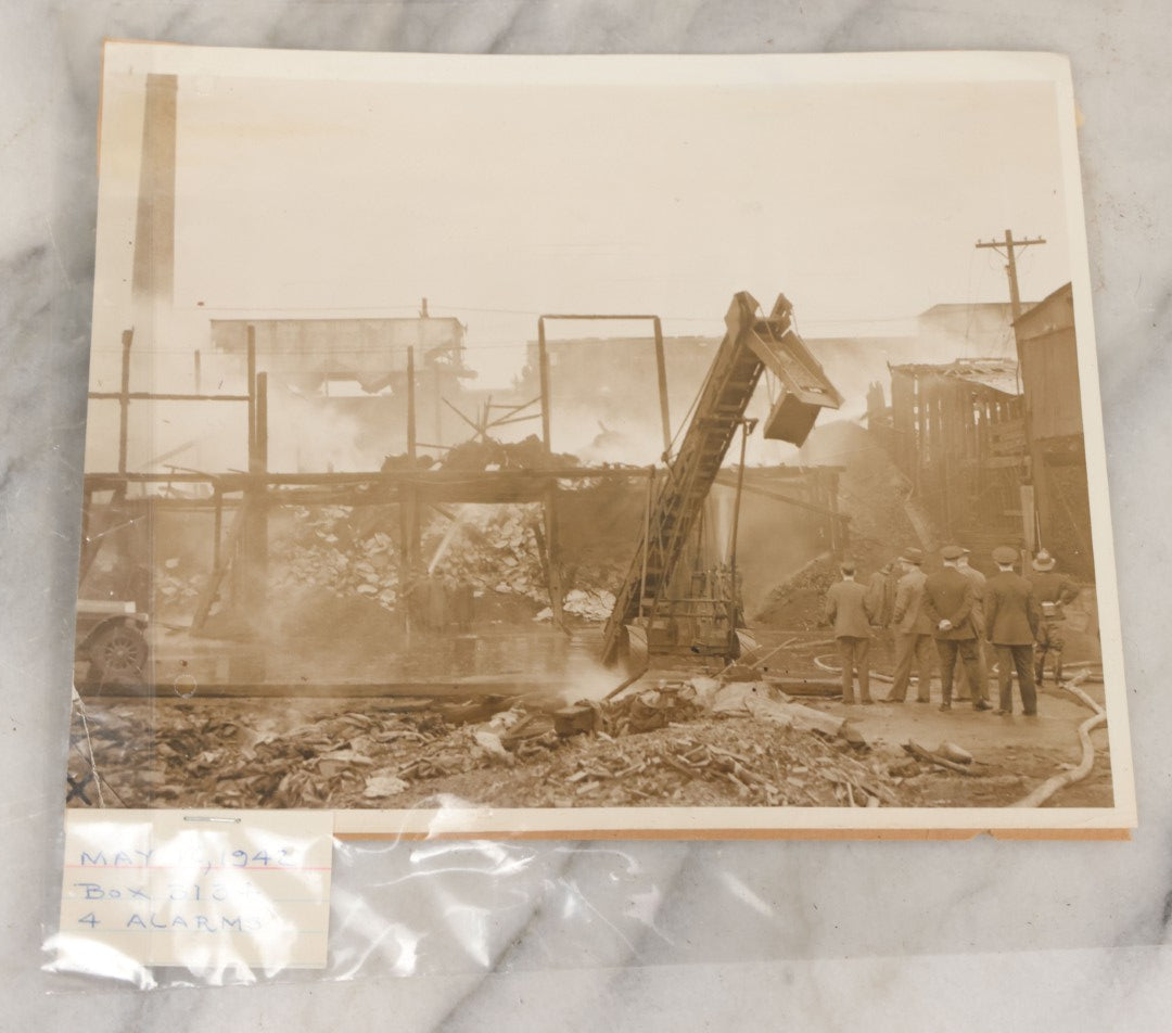 Lot 001 - Extensive Grouping Of 100+ Documentary Press Photos Of Firefighters Battling Fires, Aftermath And Destruction, And Firefighting Apperatus, In And Around The City Of Boston, Late 1930s To 1950s, With Notes Regarding Date And Location, 9" x 7"