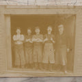 Lot 070 - Antique Flush Mount Boarded Occupational Photograph Of Group Of Five Burly Workers Posing In A Doorway, James A. Phinney Identified, Boston Photographer Mark On Verso