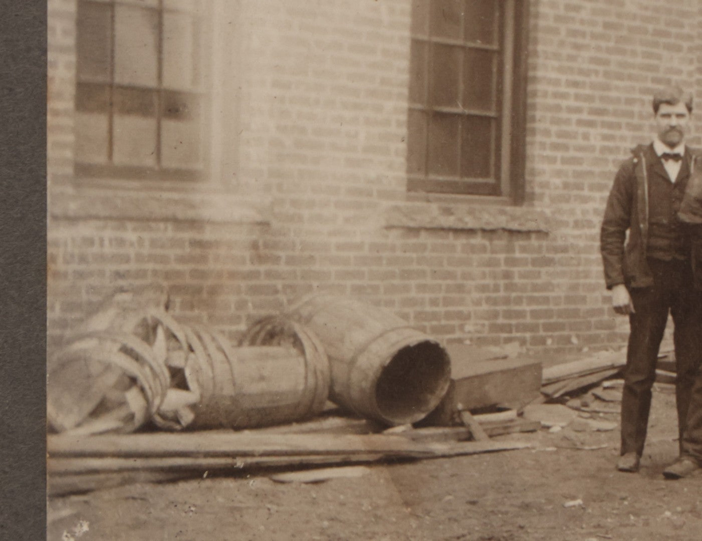 Lot 071 - Antique Boarded Occupational Photograph Of Group Of Seven Dirty Workers Posing In Work Clothes Outside Brick Workplace