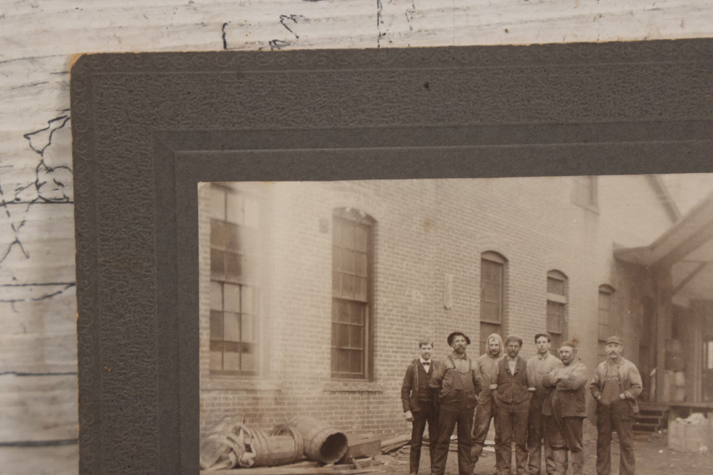 Lot 071 - Antique Boarded Occupational Photograph Of Group Of Seven Dirty Workers Posing In Work Clothes Outside Brick Workplace